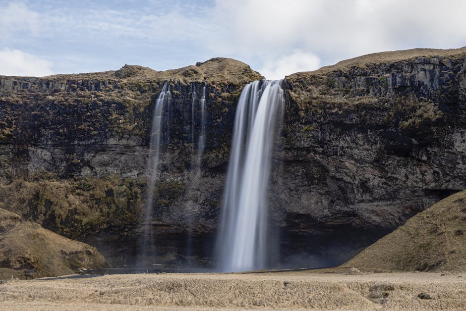 Breathtaking view of Seljalandsfoss waterfall cascading from cliffs in Iceland
