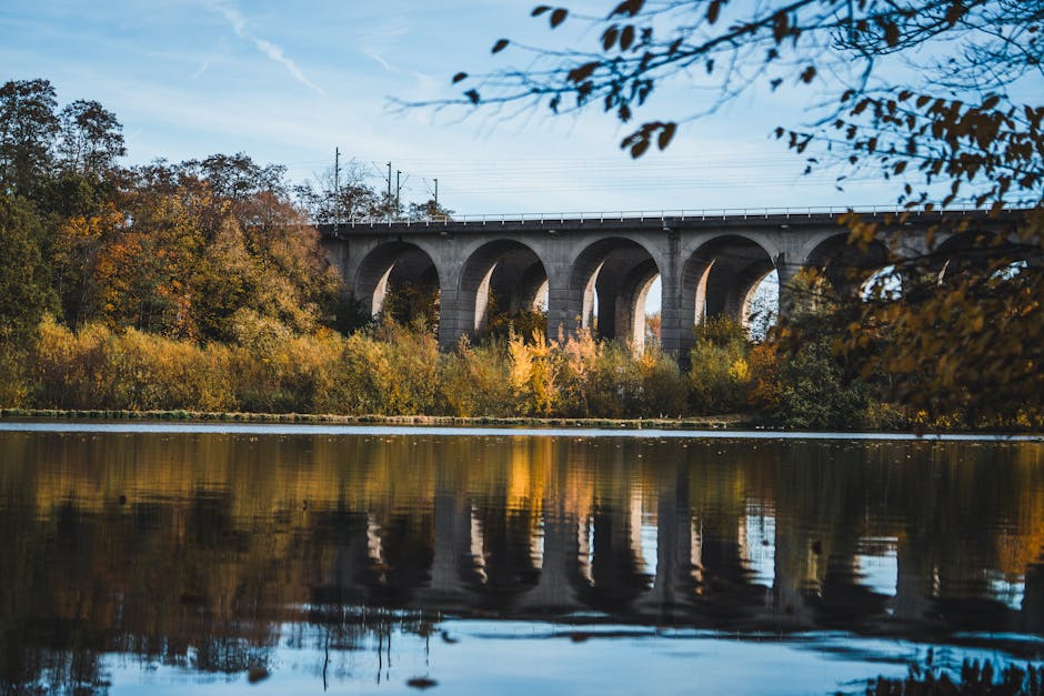 Beautiful autumn landscape with viaduct reflection in Bielefeld, Germany
